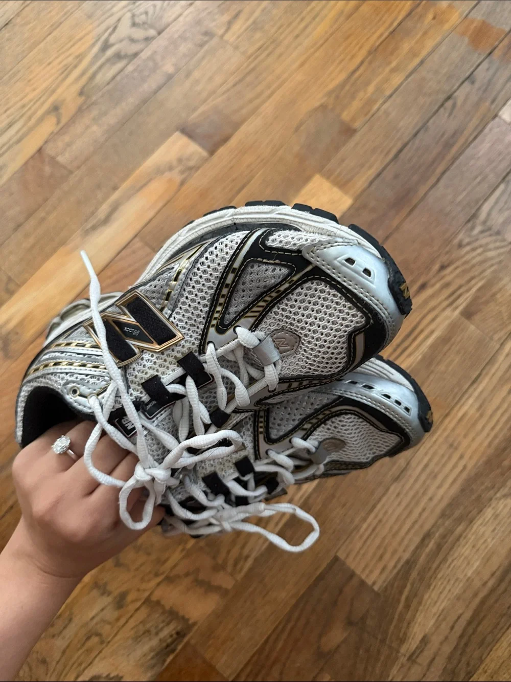 New Balance White Sneakers with Black and Gold Accents
